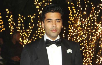 Karan Johar wants love filled with pain